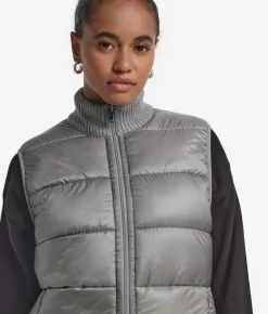 Piumino smanicato reversibile in bouclé
